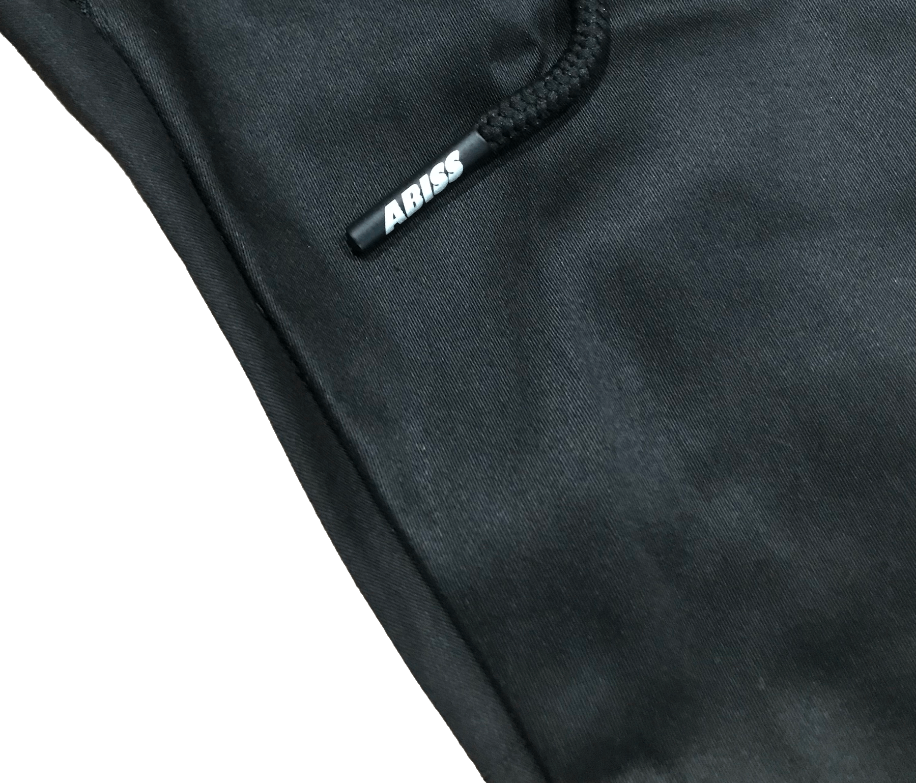 Close-up of C2-K1 pants showing Abiss Apparel custom printed aglet, part of unique streetwear collection.